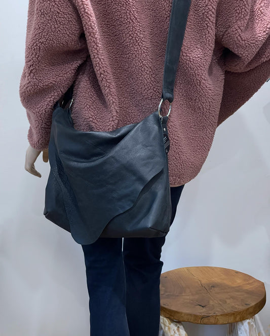 Distressed Black Leather Crossbody Bag with asymmetrical flap