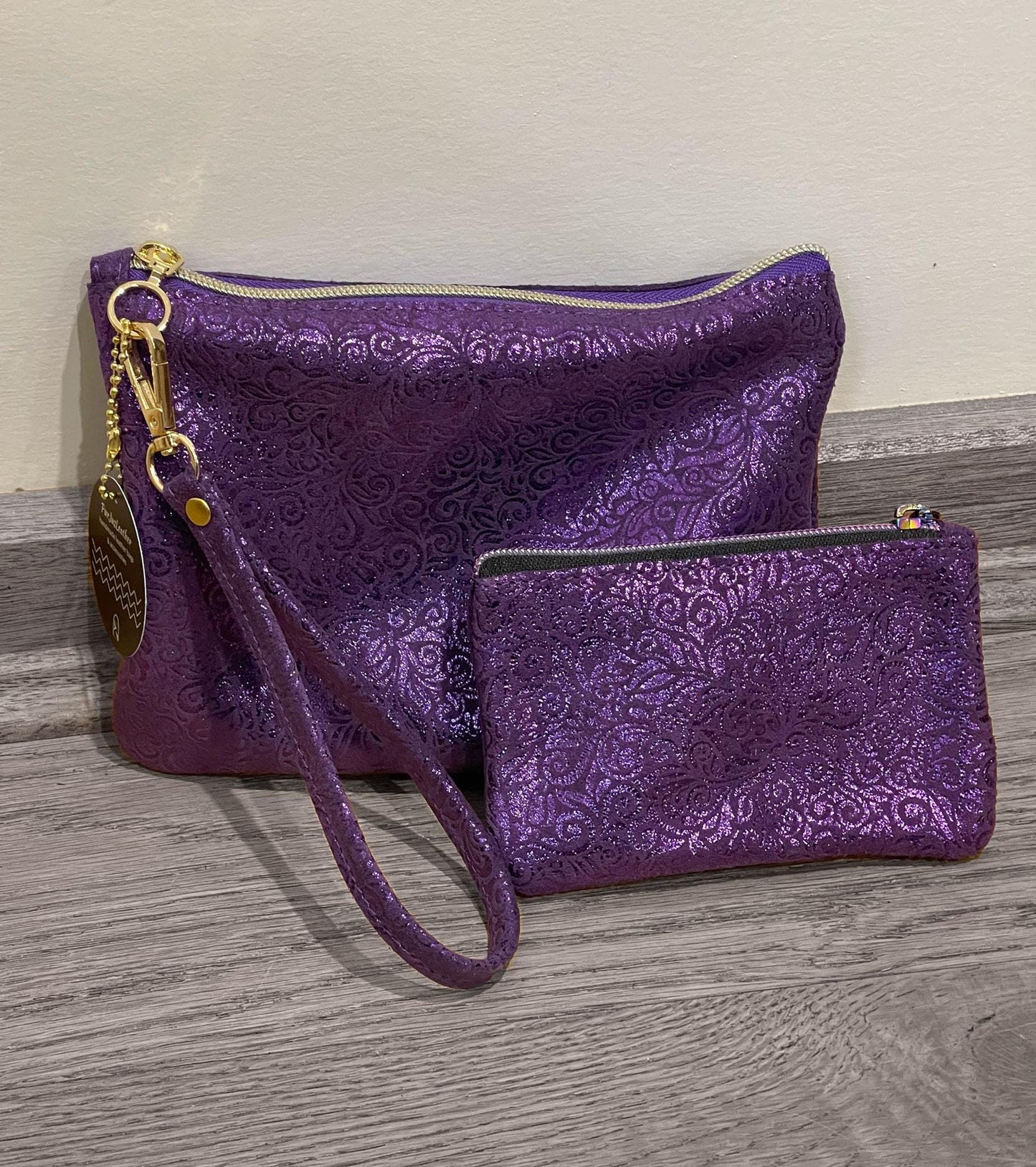 Purple Metallic leather wristlet with purple metallic print