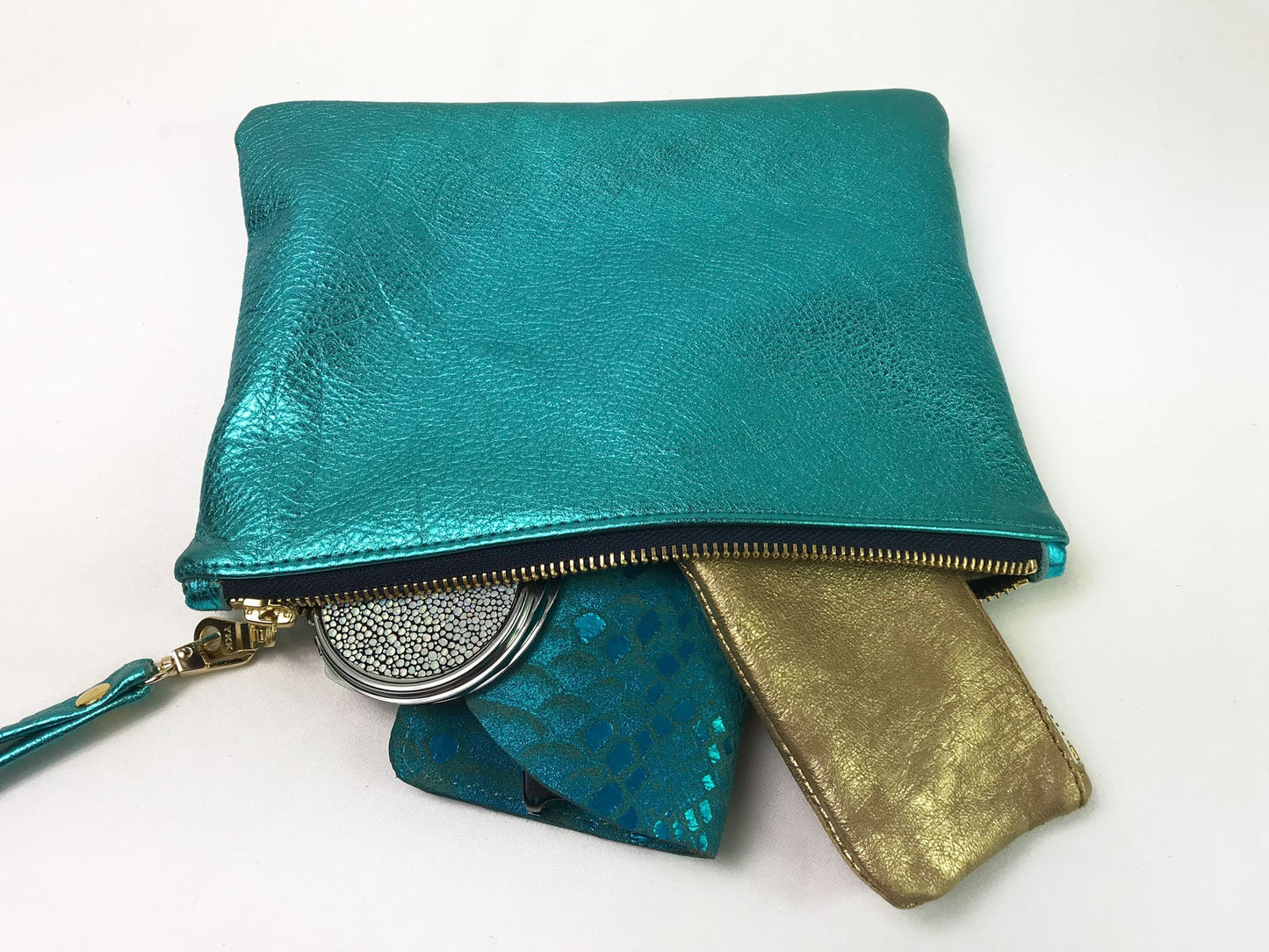 Purple Metallic leather wristlet with purple metallic print