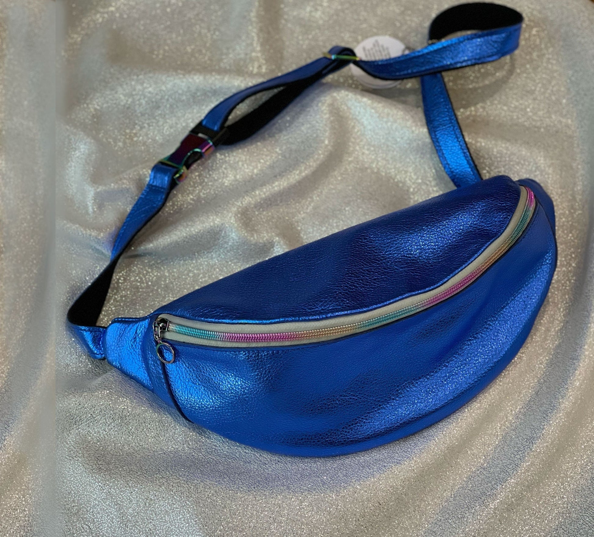 Metallic cobalt blue fanny pack with a colorful zipper 