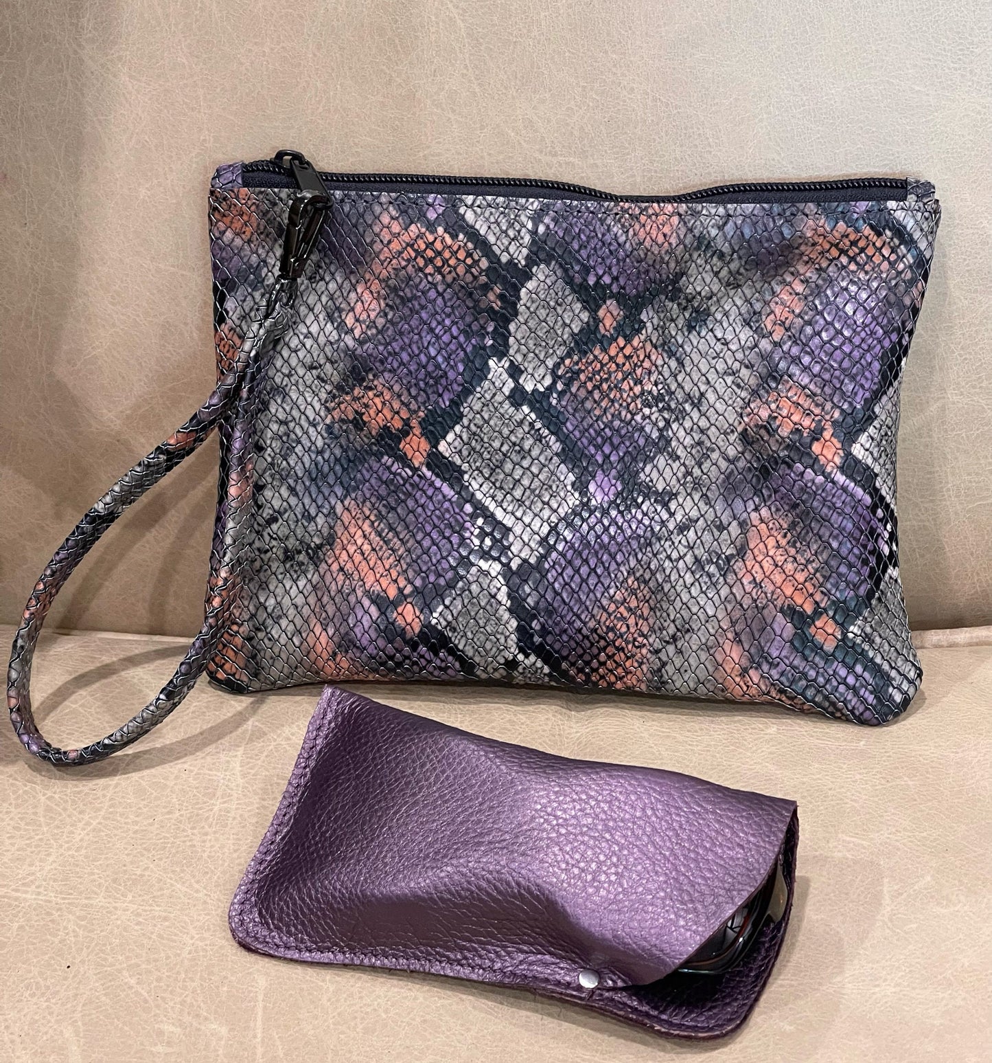 Snake embossed clutch leather wristlet
