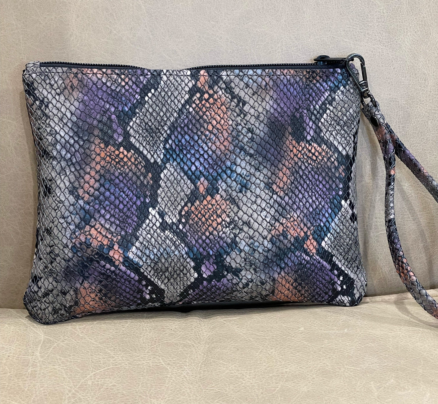 Snake embossed clutch leather wristlet