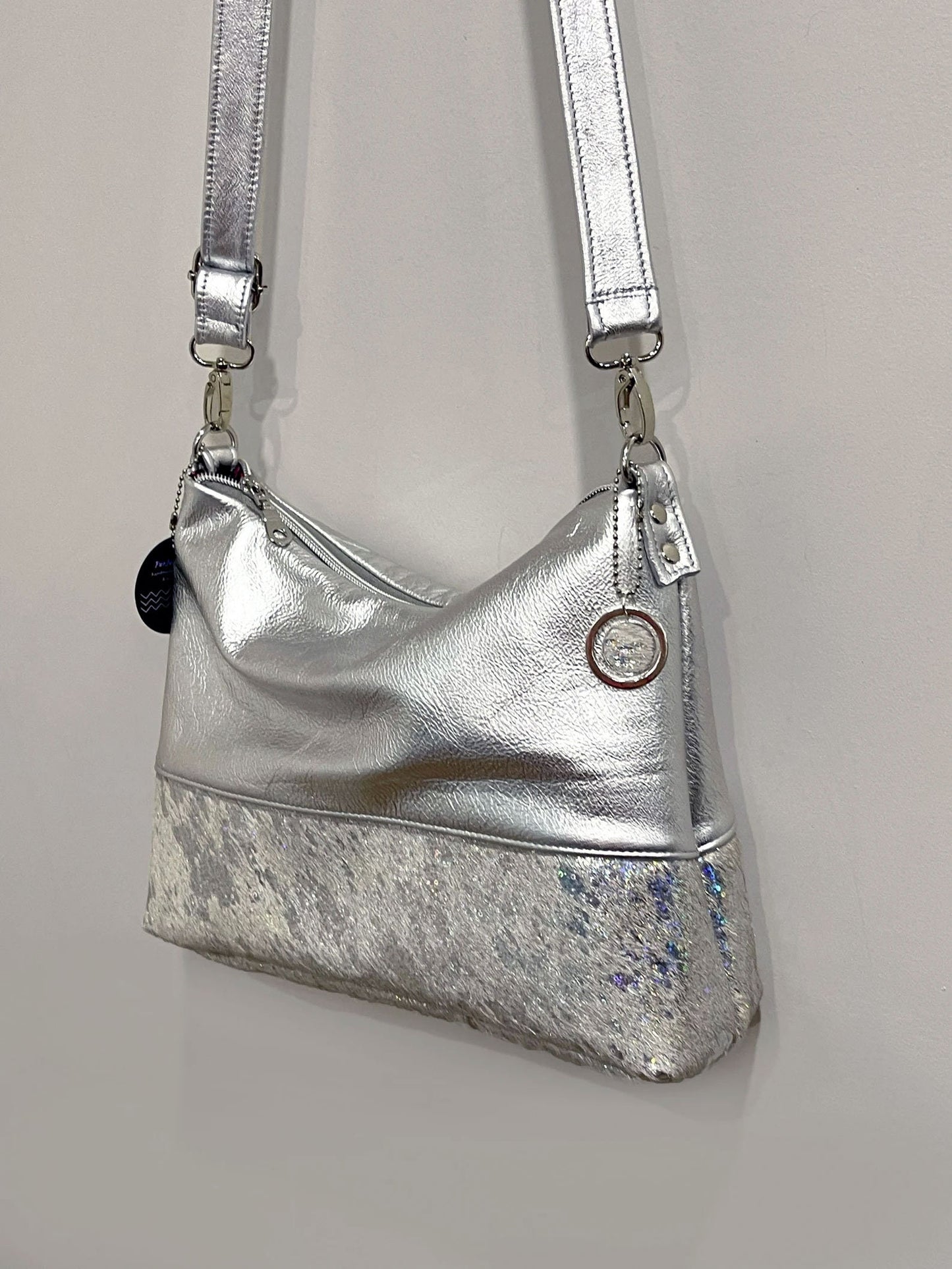 Holographic iridescent cowhide and metallic silver leather bag