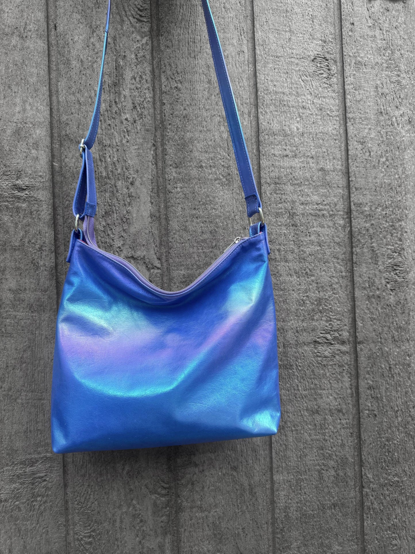 Metallic Rainbow on blue Aurora leather crossbody bag, smooth soft highlights leather bag
