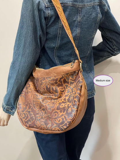 Large brown tooled embossed leather hobo bag