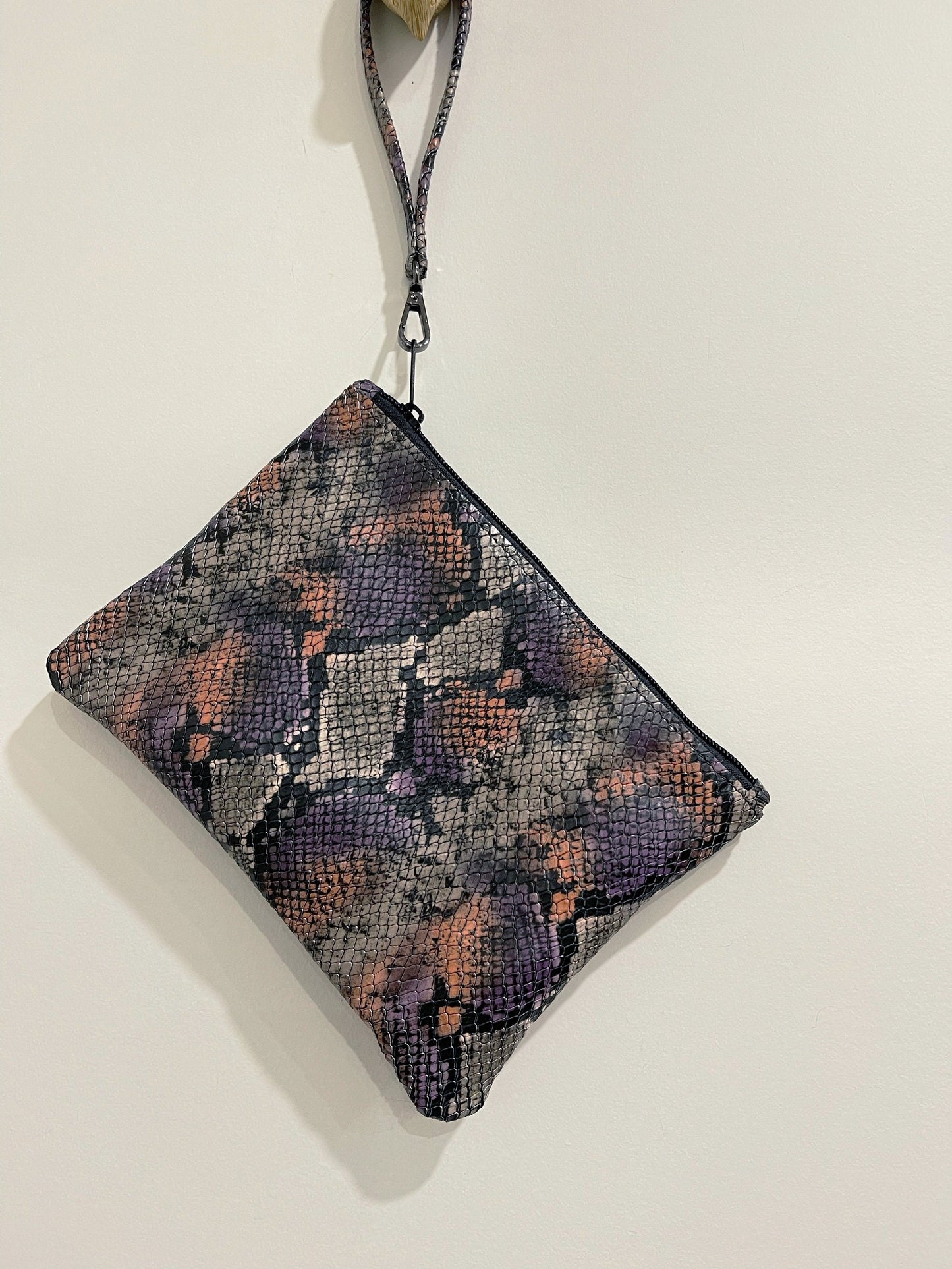 Snake embossed clutch leather wristlet