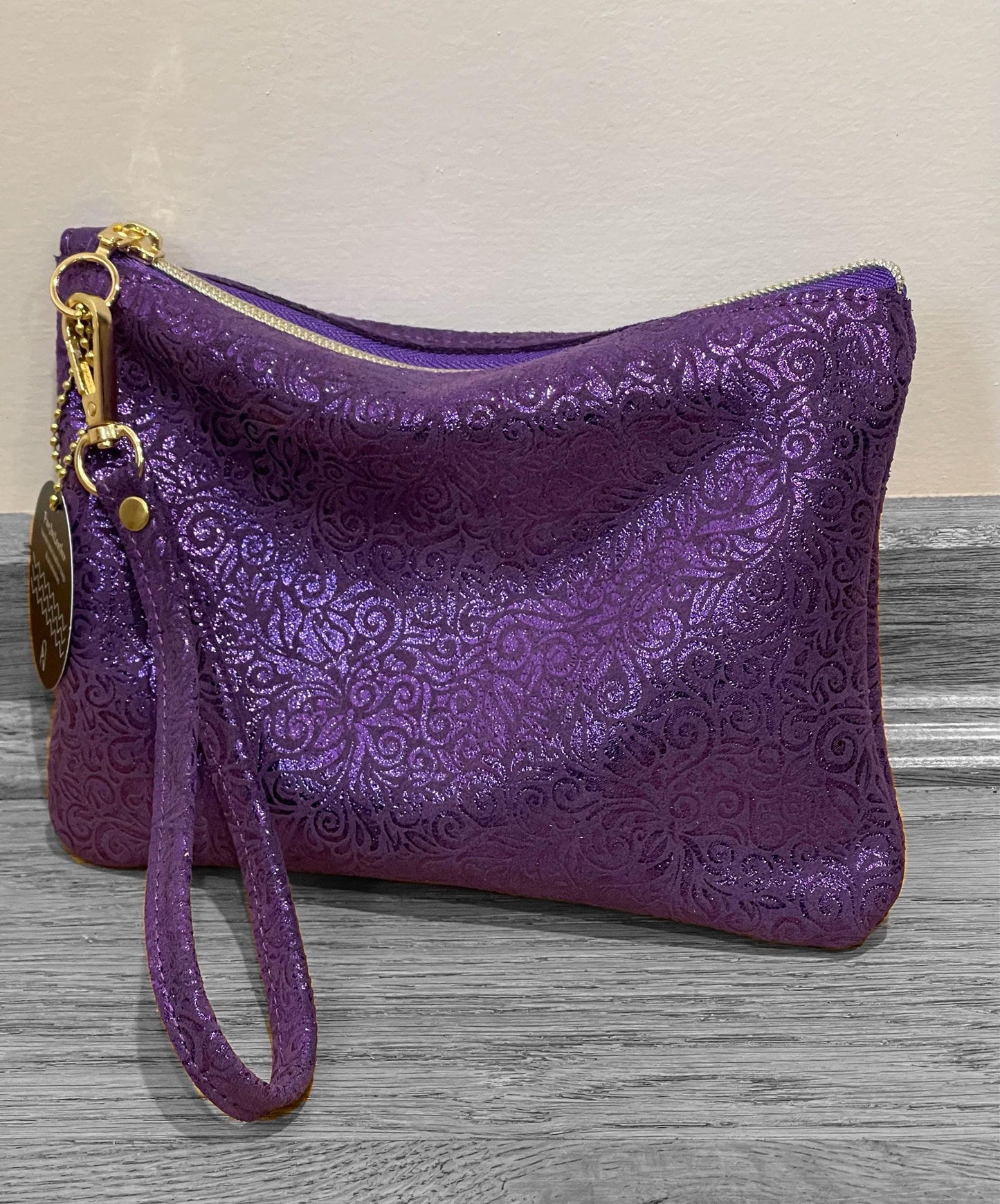 Purple Metallic leather wristlet with purple metallic print