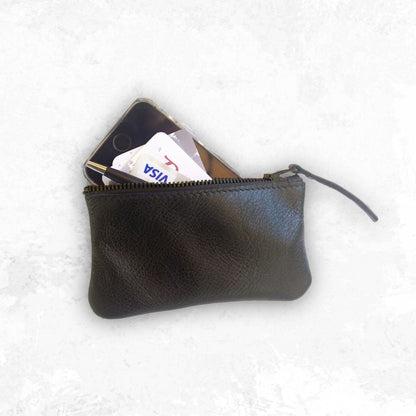 Black leather pouch with a phone and card inside on a white background