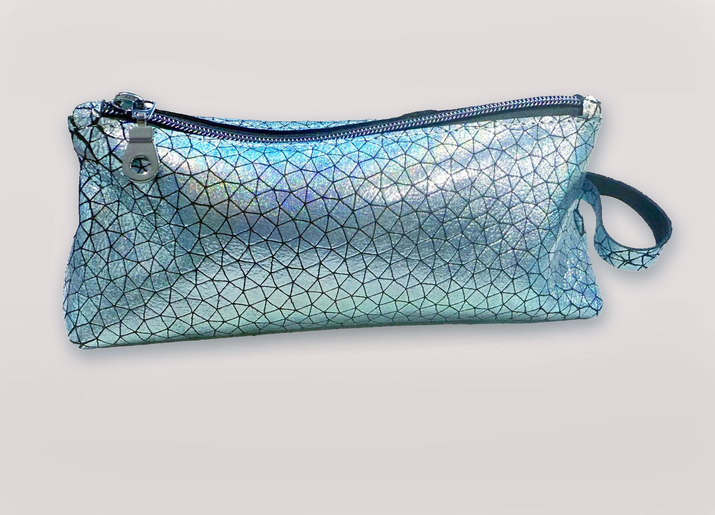 silvery Blue iridescent geometric patterned pouch on a light gray background