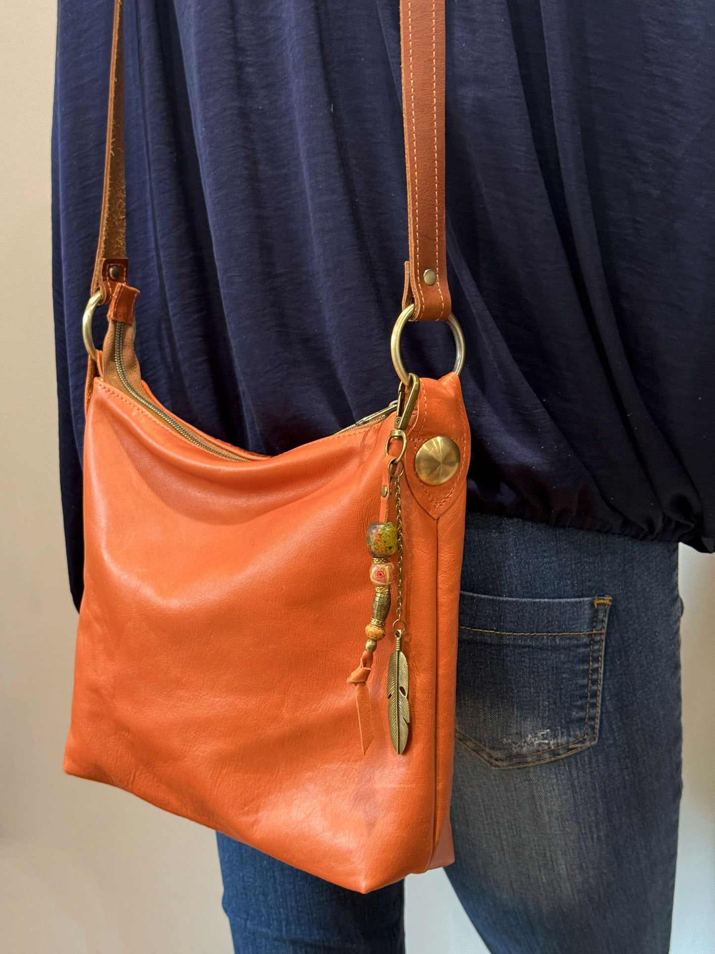 butter soft burnt orange bag with gold hardware