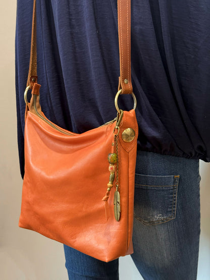 butter soft burnt orange bag with gold hardware