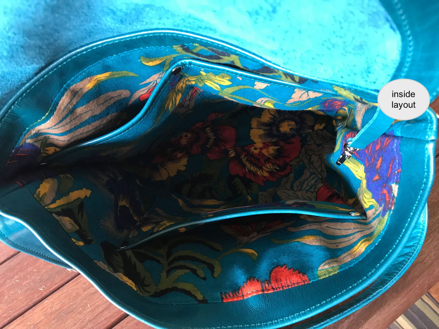 teal bag inside teal floral lining