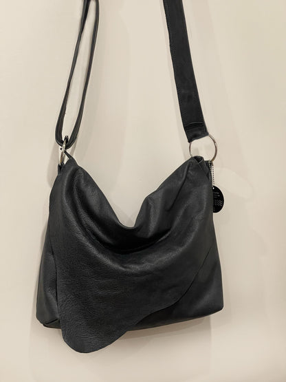 Distressed Black Leather Crossbody Bag with asymmetrical flap