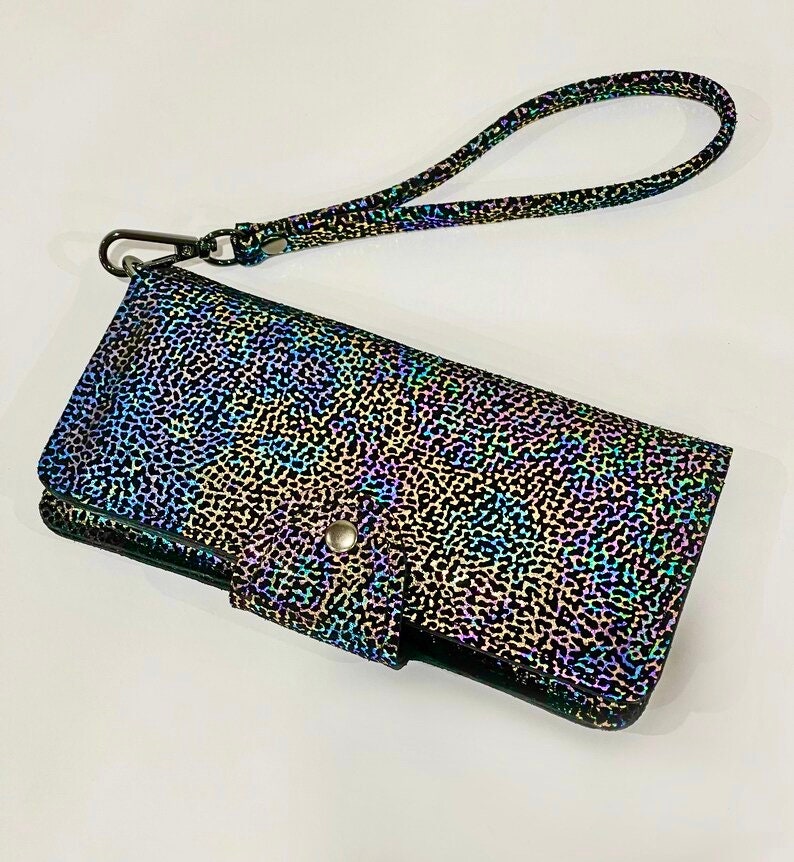 Multicolored patterned wallet with wrist strap and wide tab press clasp