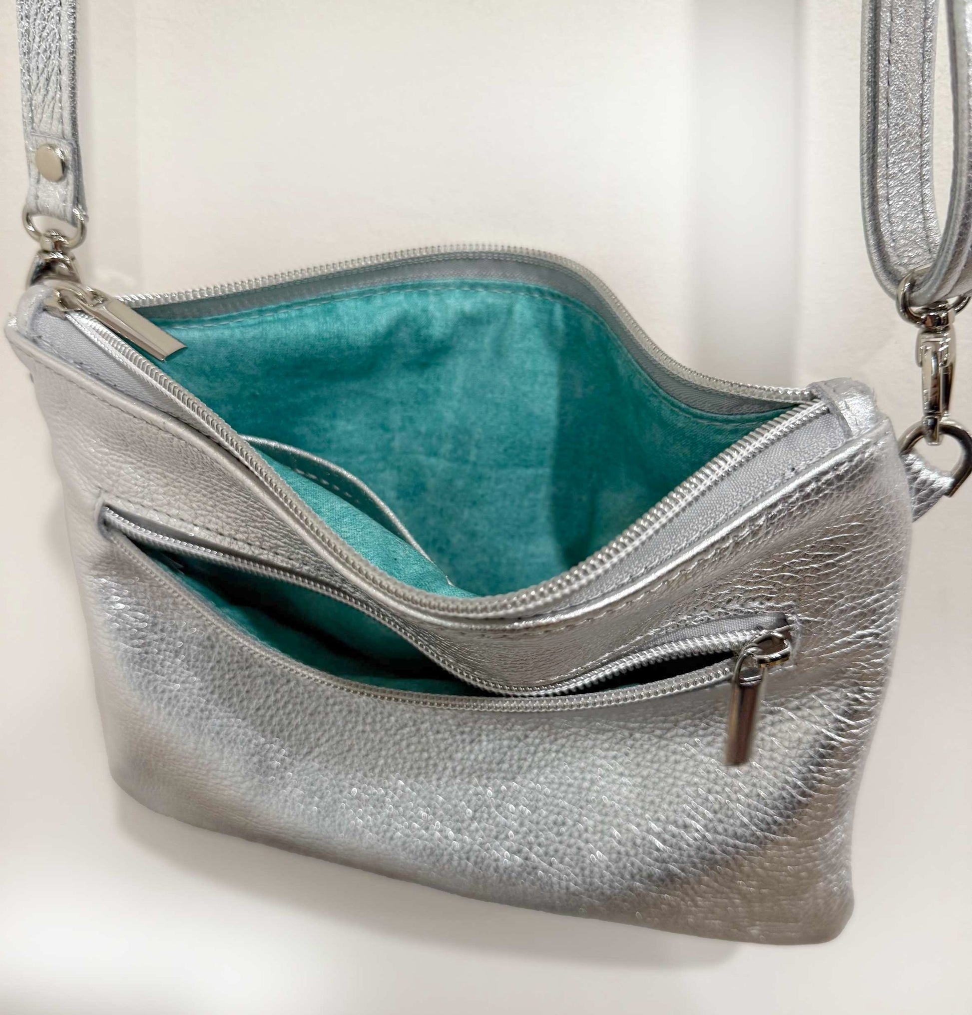 Silver handbag with aqua interior 