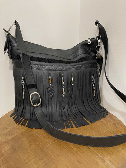 Black leather fringe handbag with beaded leather metal charms and solid silver buckle