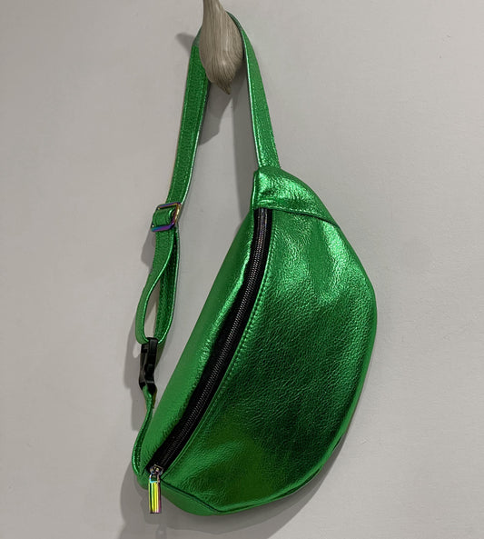 Green metallic fanny pack on a gray background