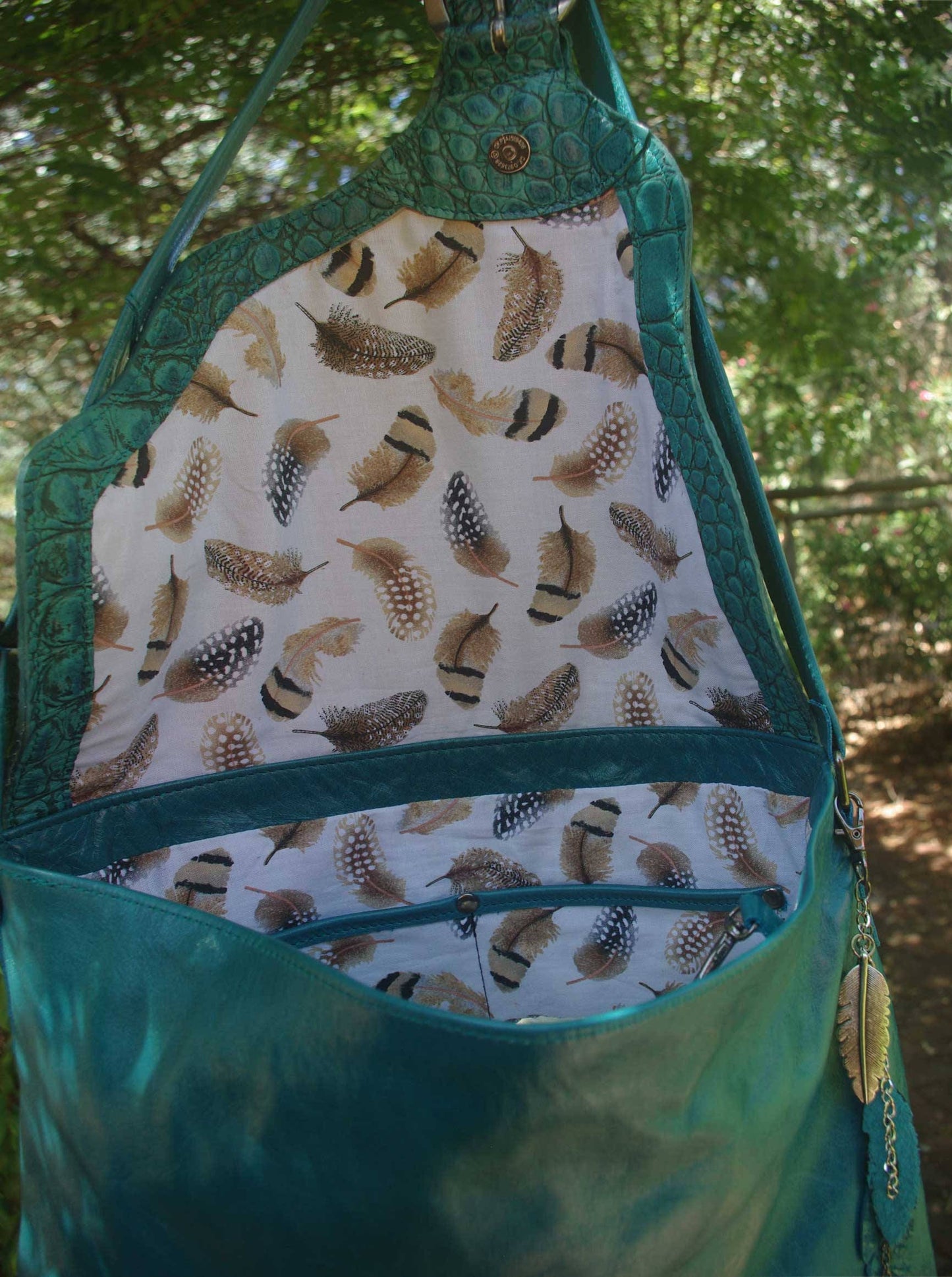 Teal leather crossbody, asymmetrical flap