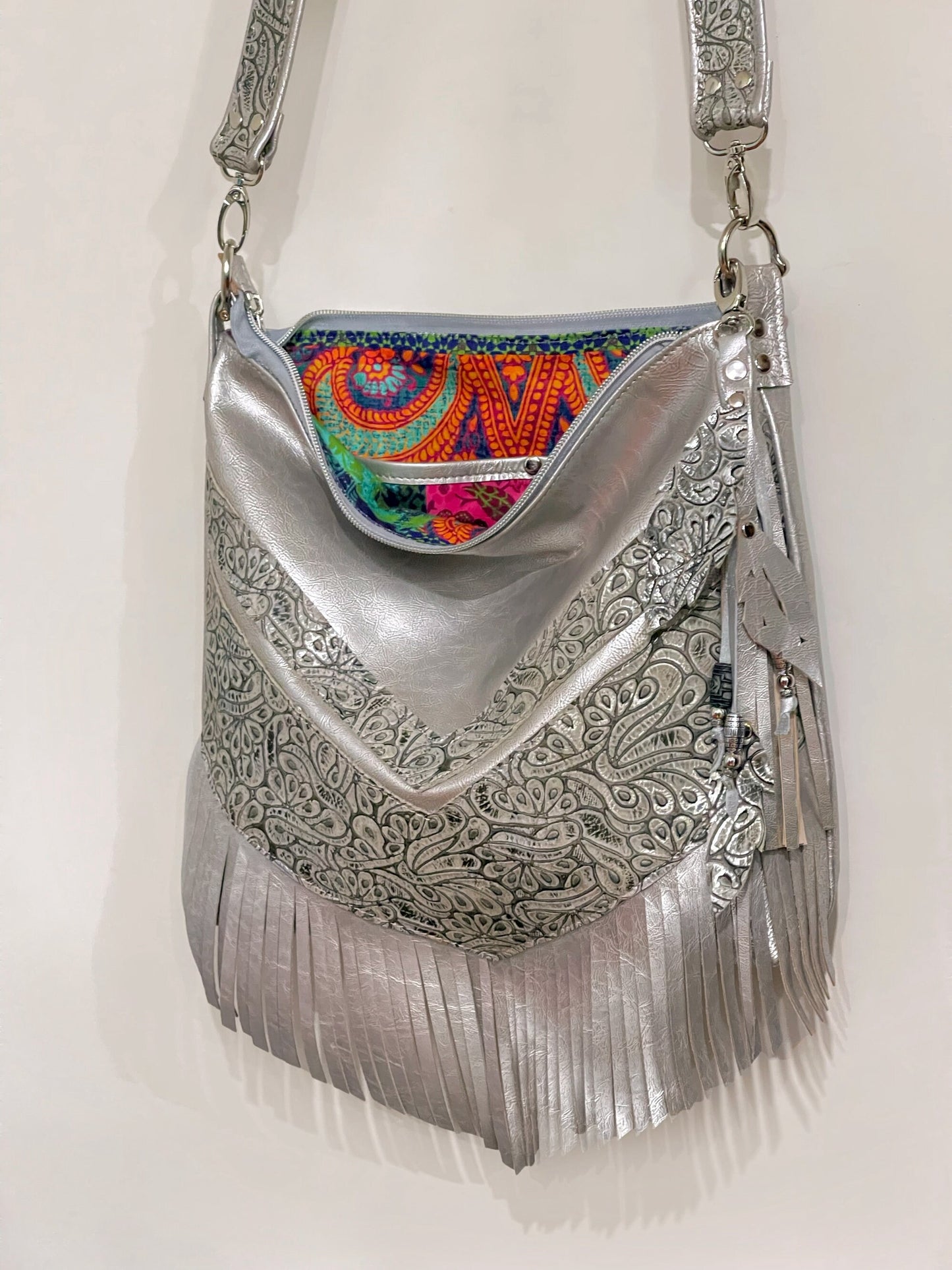 Metallic silver Leather Fringe Hobo Bag with featured tooled leather