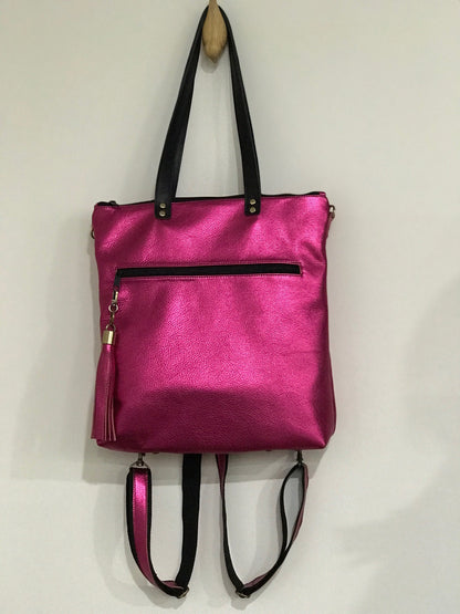 Hot Pink metallic leather tote bag with black handles and zippers with removable backpack straps and matching tassel