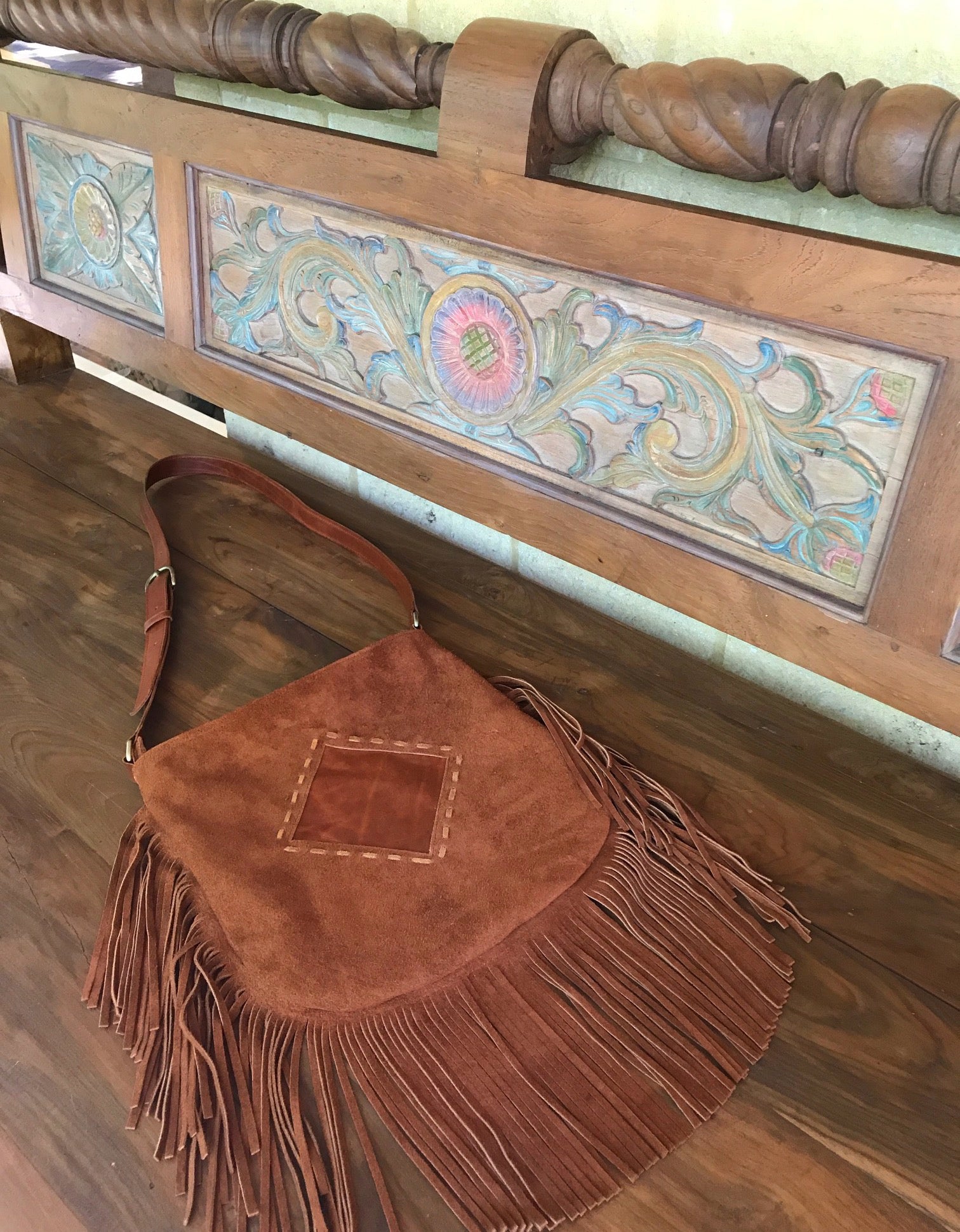 warm brown suede bag with large fringe and leather insert zipper close. adjustable strap