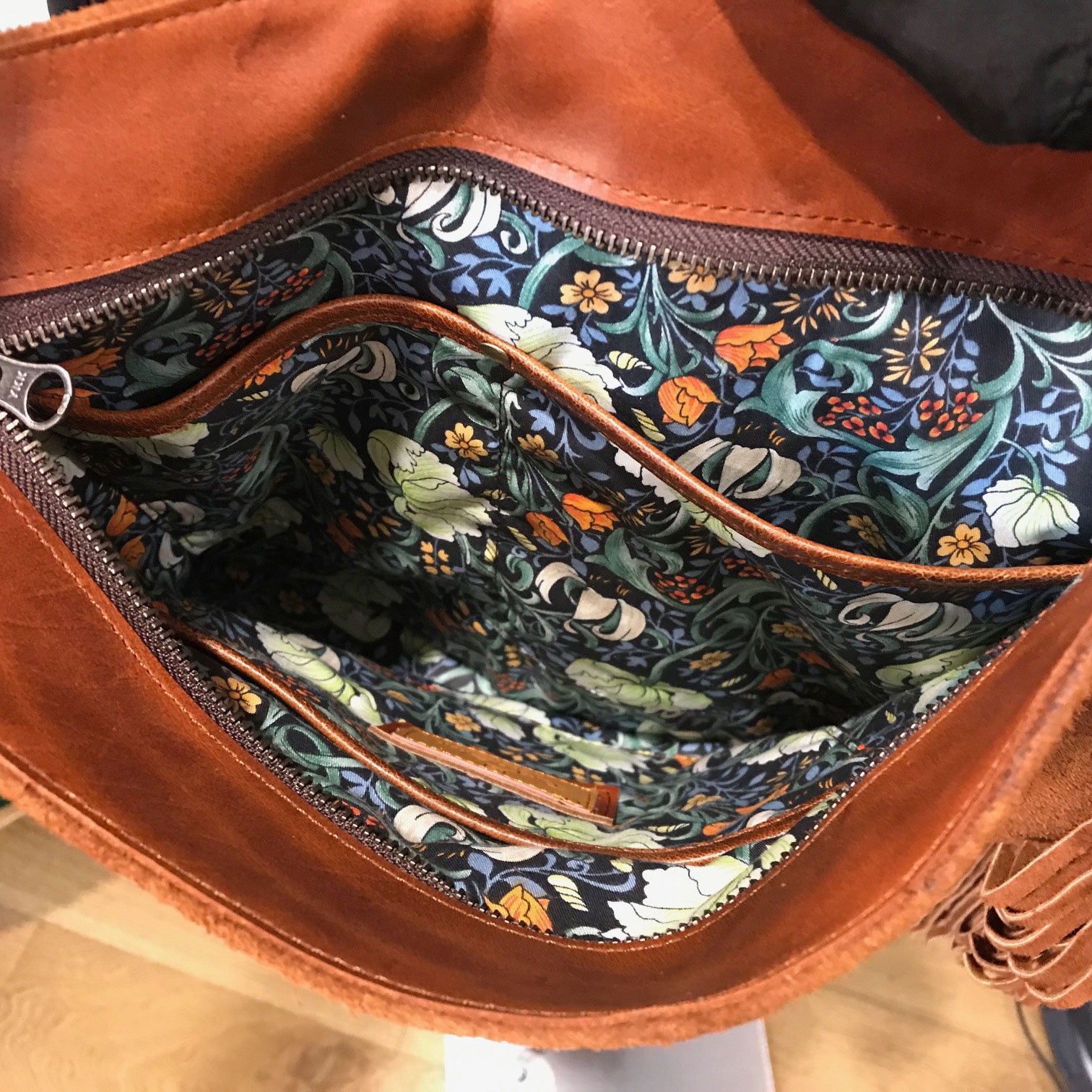 floral lining with slip pockets inside zipper closure bag