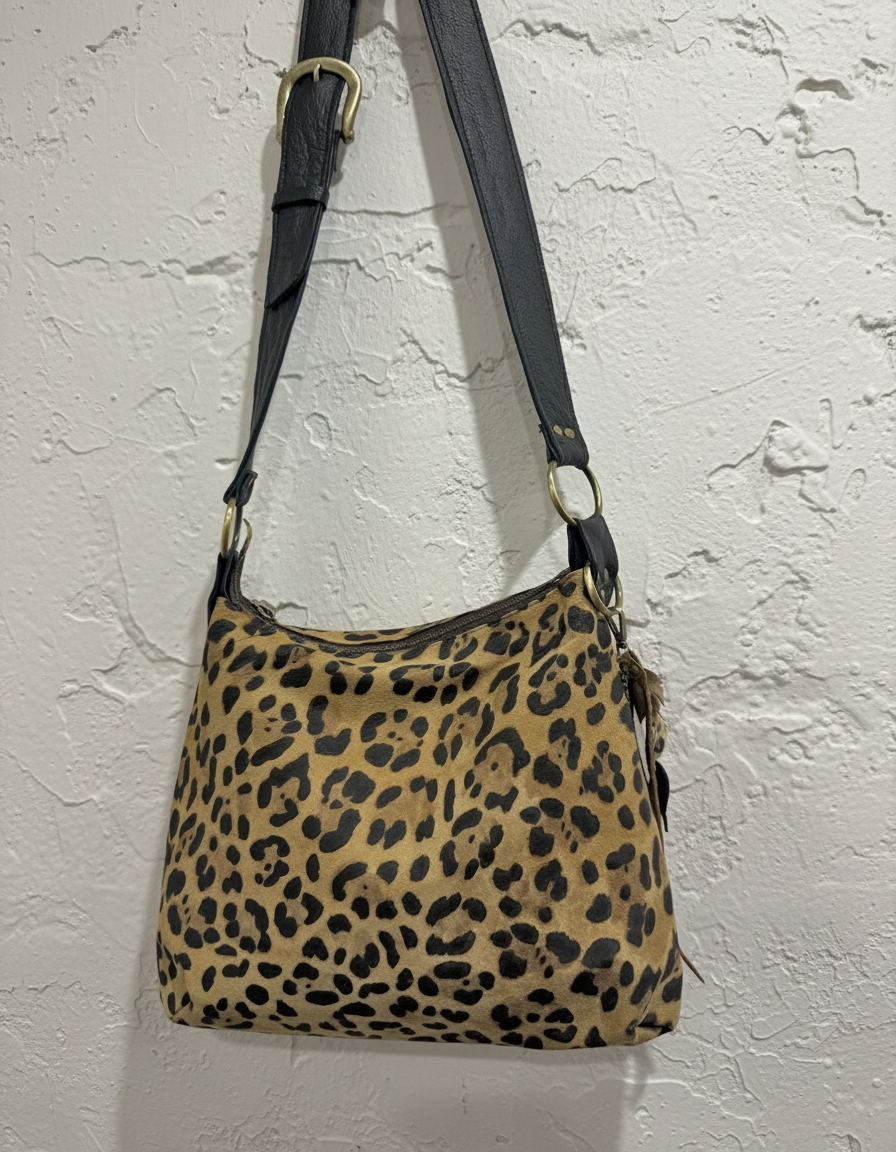Leopard bag on rustic textured wall