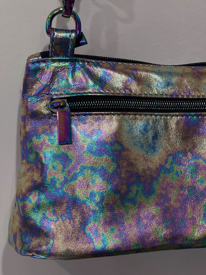multi colour metallic pouch with a zipper pocket and zipper closure on a plain background
