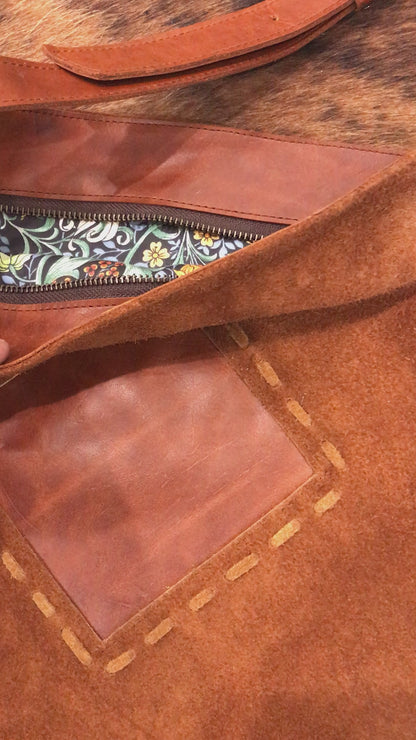 video of brown suede bag inside zip closure with close up image