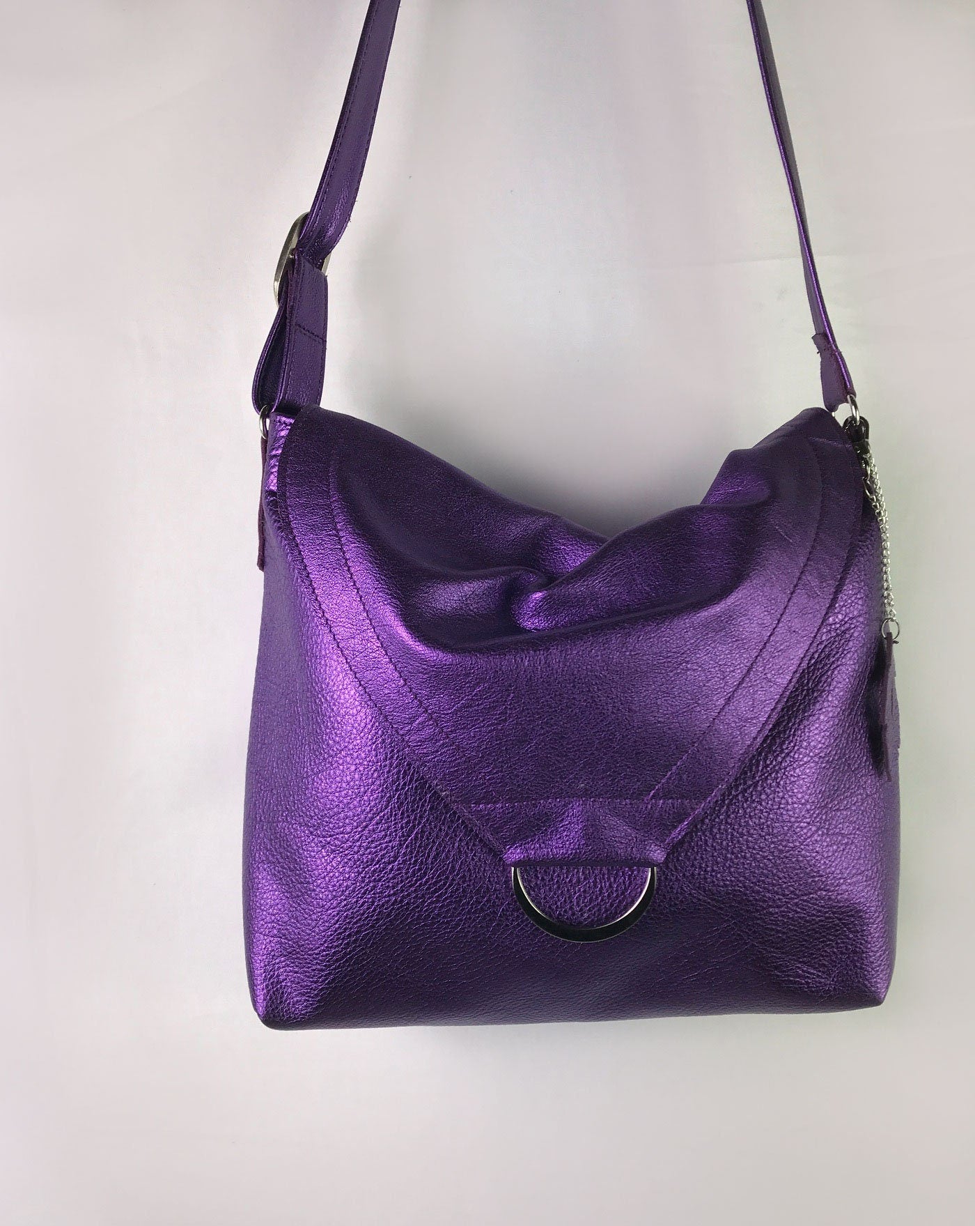 Purple leather handbag on a light gray background