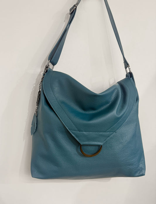 Handmade teal leather crossbody bag with magnetic closure